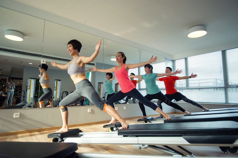 Woman practicing body awareness in Pilates